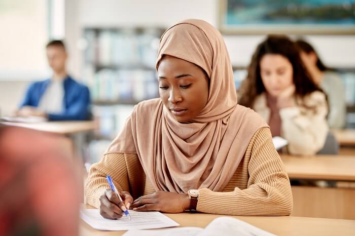 group of students take an exam for the caribbean university